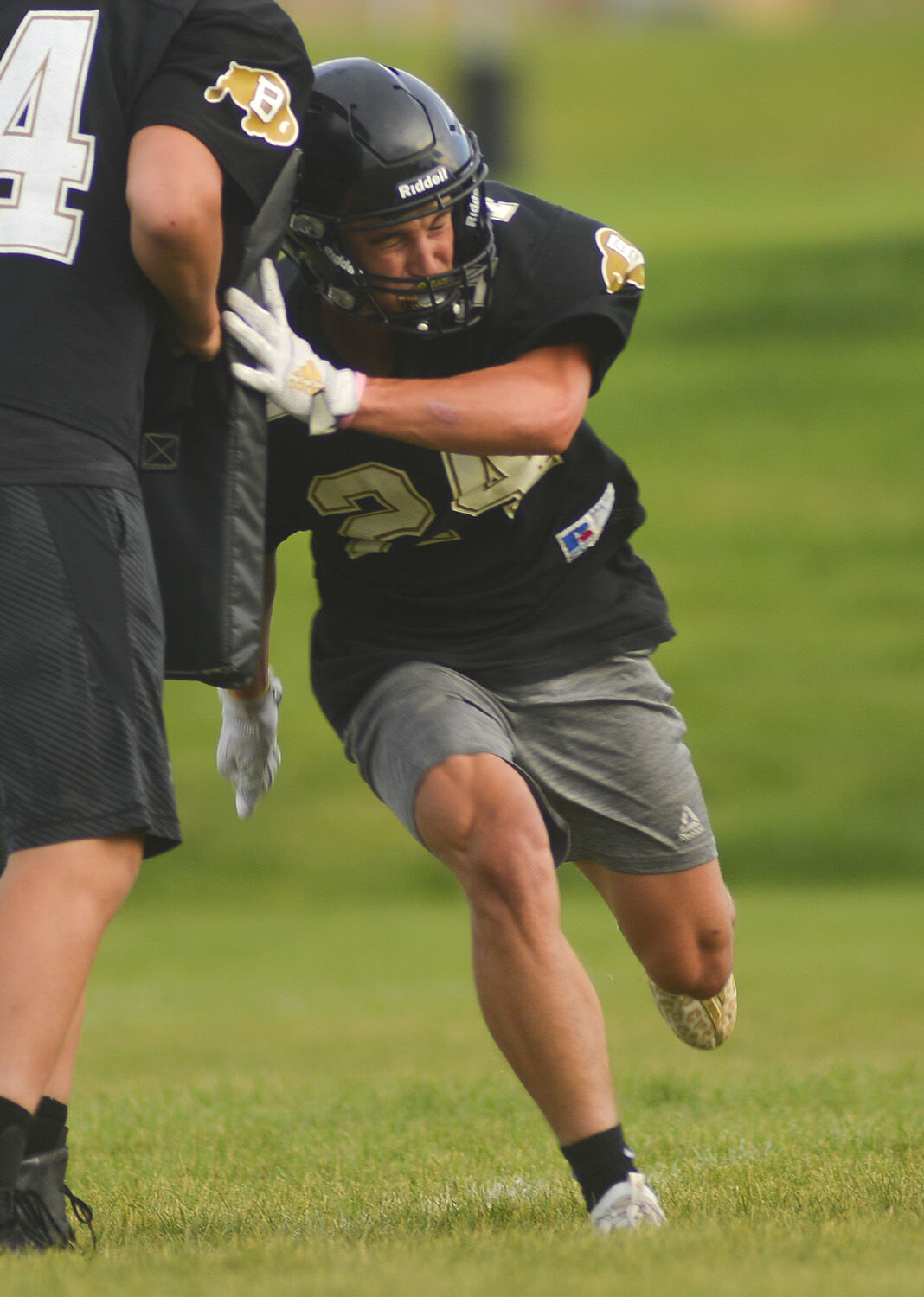 Blake Bell lunges through the second block before continuing